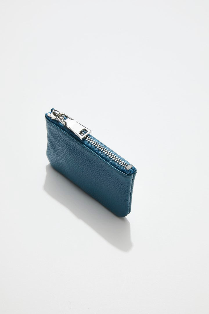 top view of mon purses' sky blue pebbled leather coin purse with silver zip