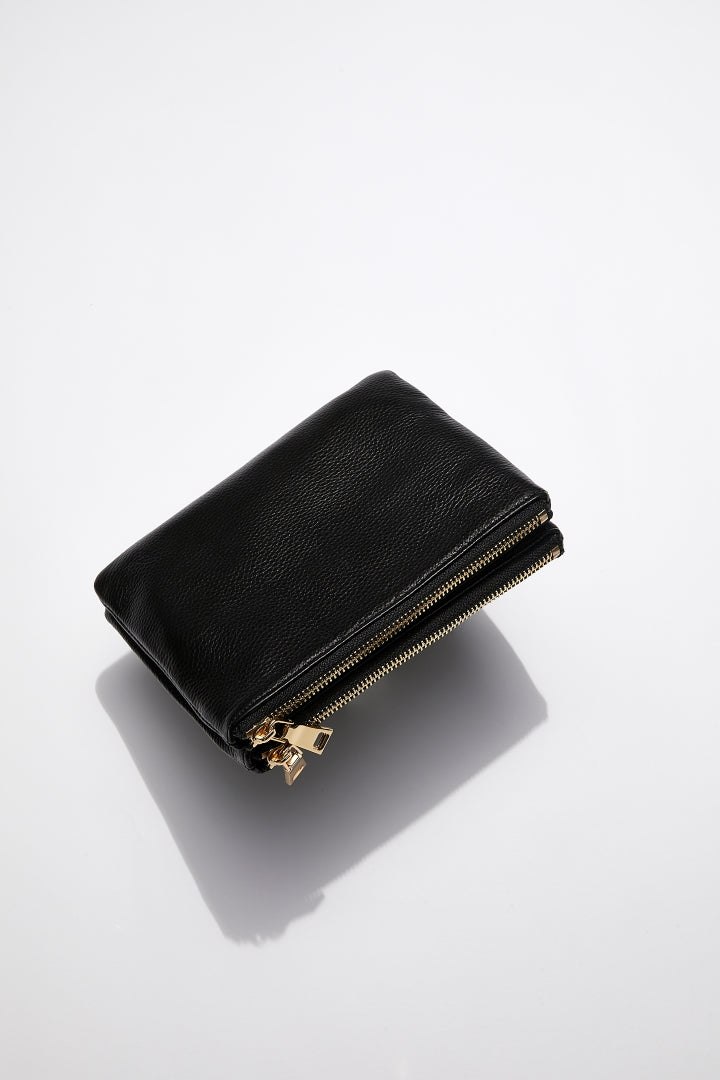 back view of MON Purses' double pouch bag in black pebbled leather with gold hardware without the long shoulder strap
