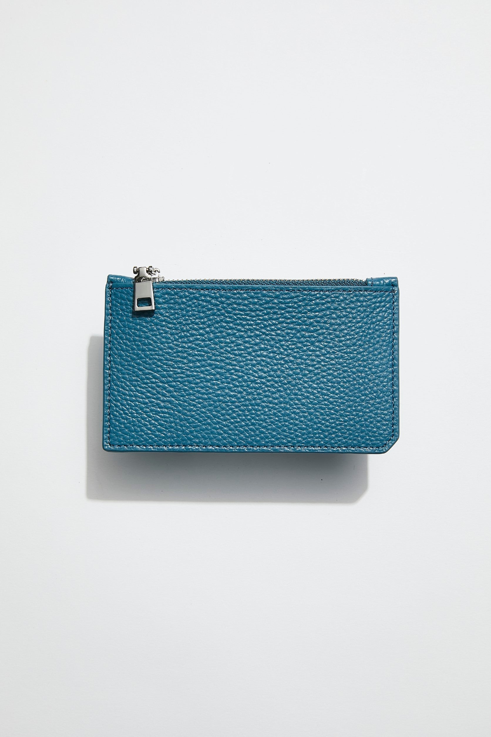 back view of mon purse's sky blue pebbled leather maxi card holder with a  silver zip closure 