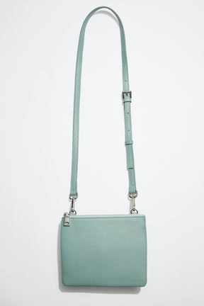 front view of mon purse's sage green pebbled leather single pouch bag