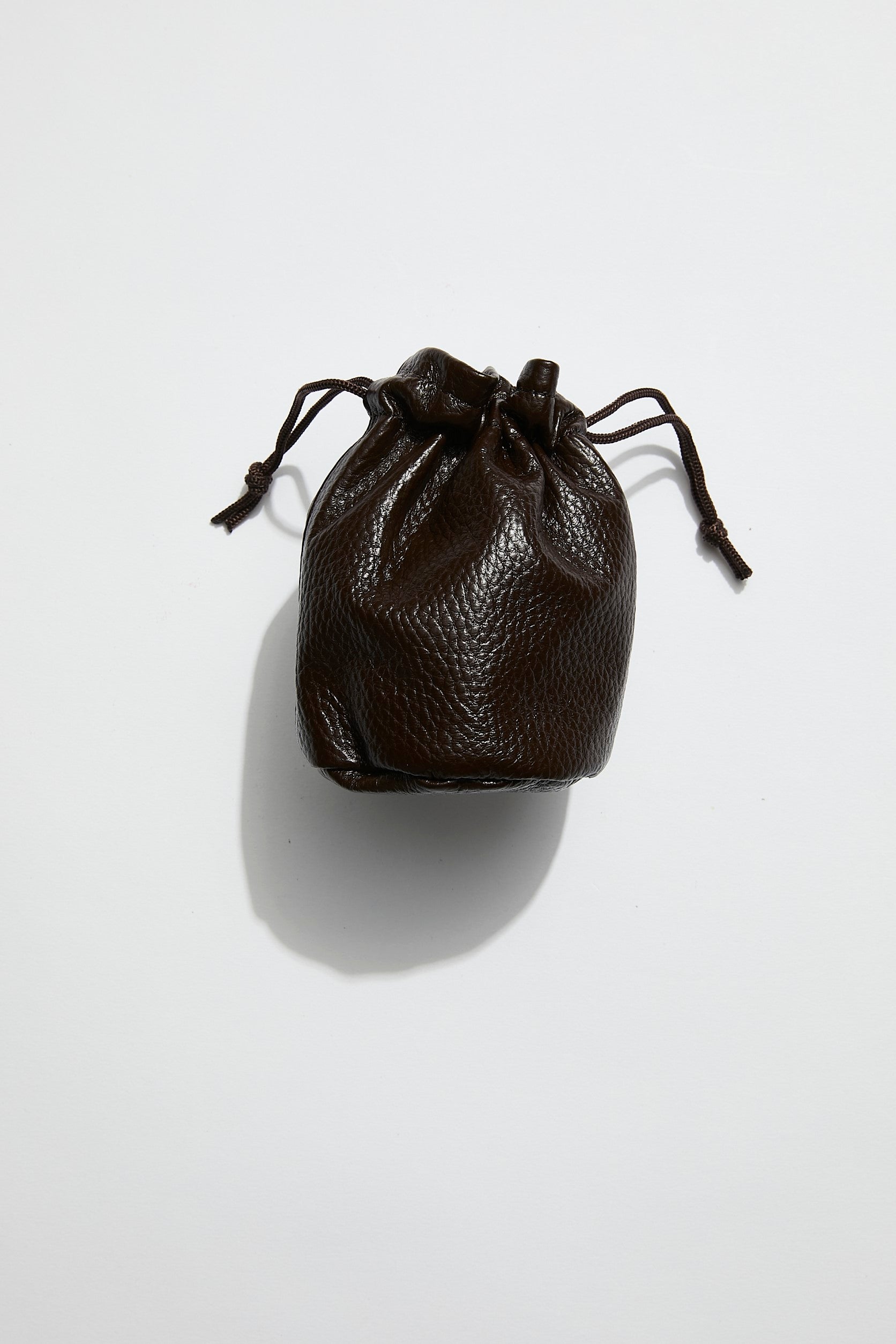 front view of mon purse's chocolate brown pebbled leather trinket pouch with drawstring closure