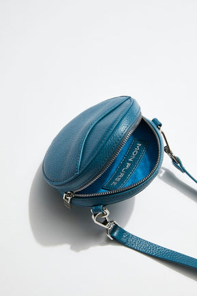 mon purse sky blue circle bag with silver hardware zip open to see inside