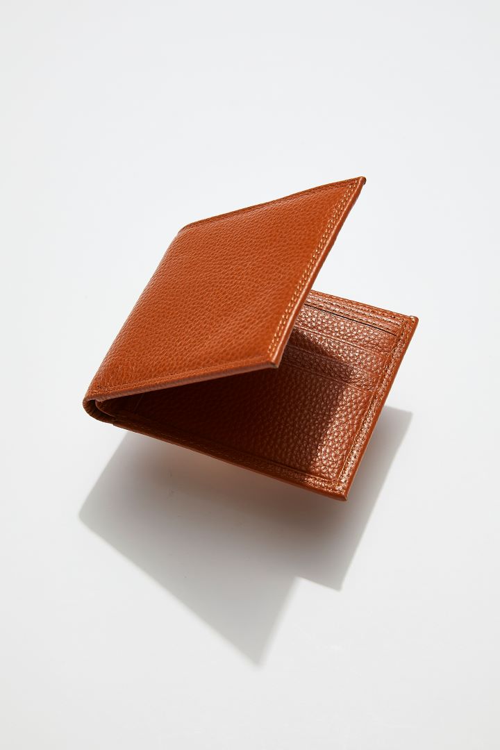 interior view of MON Purses' camel brown pebbled leather men's billfold wallet showing 3 of the 5 bank card slots