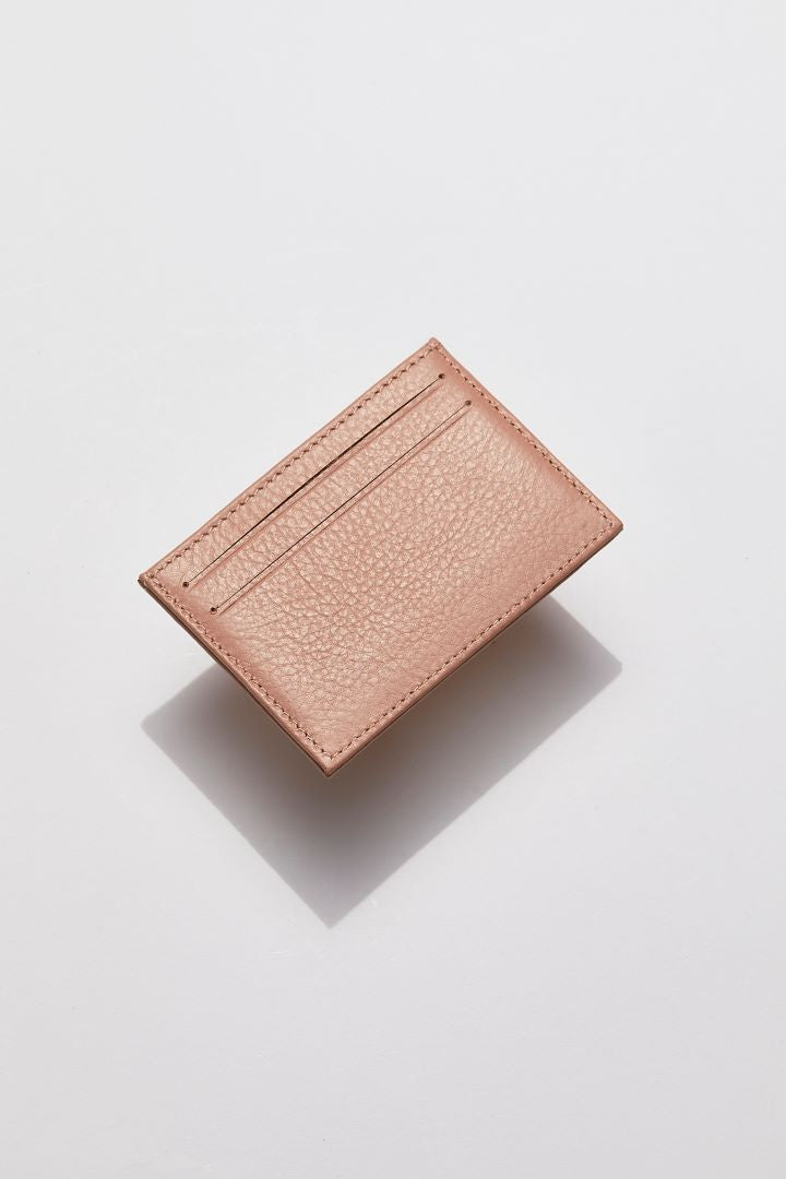 front view of MON Purses' blush pink pebbled leather cardholder for both women and men featuring 2 bank card slots