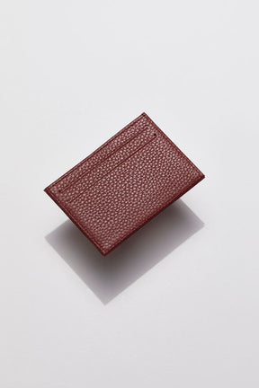 front view of MON Purses' burgundy pebbled leather cardholder for women and men featuring two bank card slots