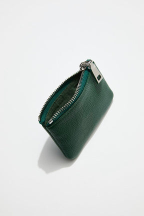 interior view of mon purses' dark green pebbled green leather coin purse with silver zip an chain with clasp
