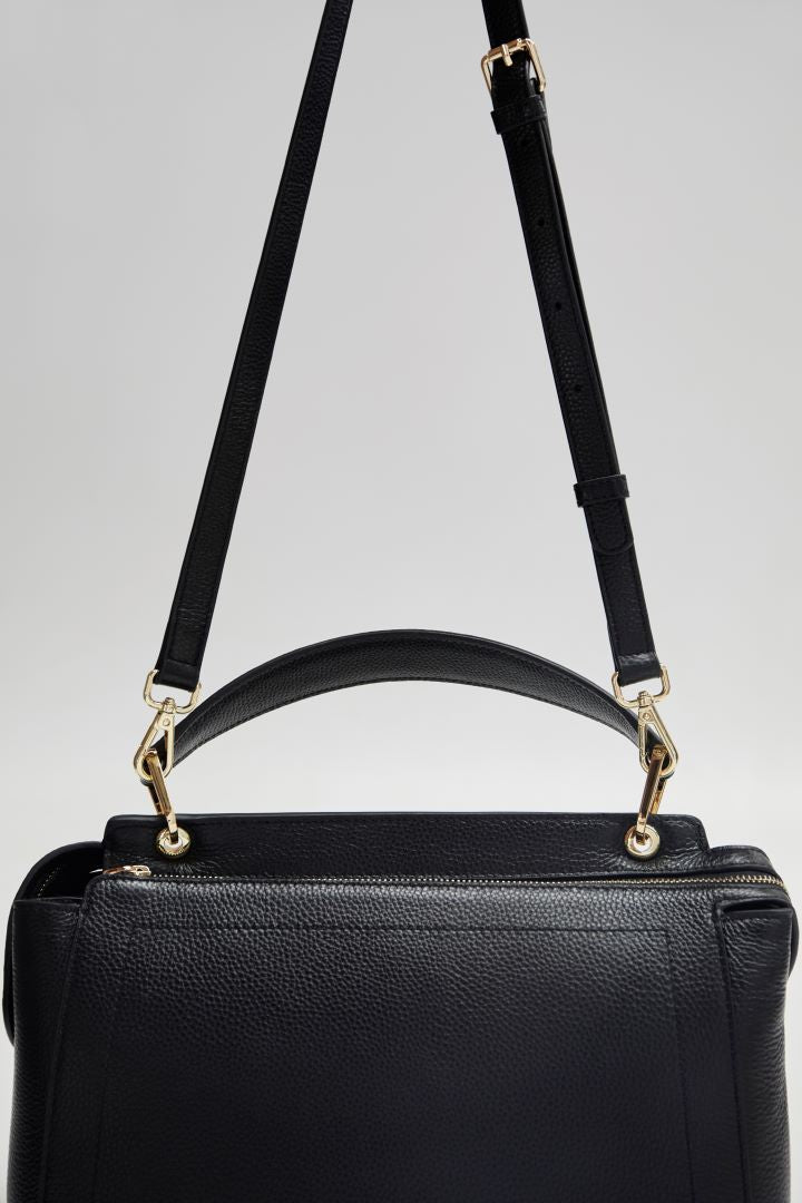 front view mon purses black pebbled leather Day Tote Bag with gold hardware with shoulder strap