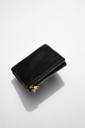 back view of MON Purses' double pouch bag in black pebbled leather with gold hardware without the long shoulder strap 