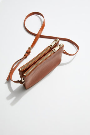 top view of mon purses' double pouch bag in camel pebbled leather with gold hardware with long shoulder strap