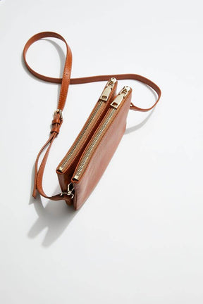 top view of mon purses' double pouch bag in camel pebbled leather with gold hardware with long shoulder strap showing zip closures of the double pouches