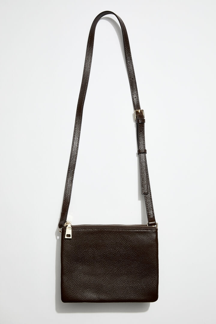 front view of mon purses' women's double pouch bag in chocolate brown pebbled leather and gold hardware with long shoulder strap 