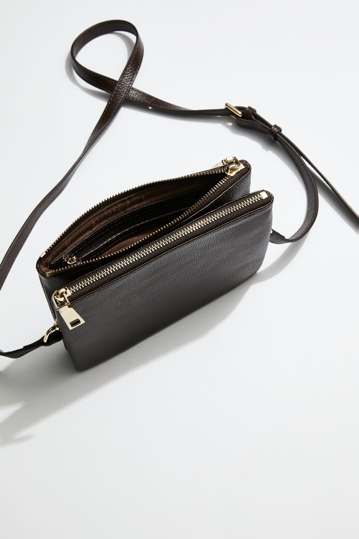 interior view of mon purses' women's double pouch bag in chocolate brown pebbled leather and gold hardware with long shoulder strap showing interior of one of the pouches of the double pouches