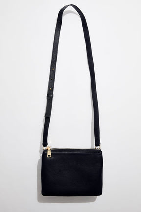 front view of mon purses' women's navy pebbled leather double pouch bag with gold hardware and long shoulder strap 