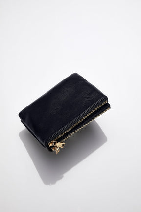 double zip view of mon purses' women's navy pebbled leather double pouch bag with gold hardware not showing the long shoulder strap 
