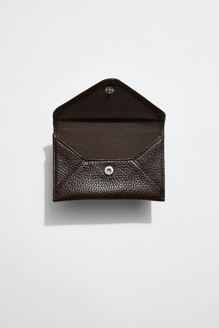 front view of mon purses' chocolate brown pebbled leather envelope card holder with the flap open to see interior