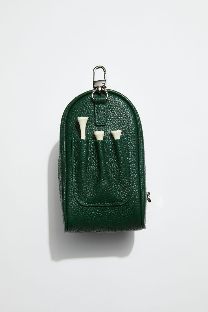 back view of mon purses' dark green pebbled leather golf ball pocket showing 3 golf tees slotted into pockets for golf tees