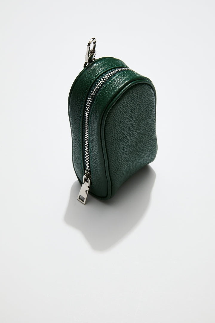 side view of mon purses' dark green pebbled leather golf pocket with silver hardware