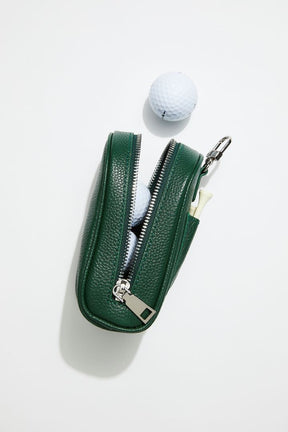 side view of mon purses' dark green pebbled leather golf ball pocket showing 3 golf balls