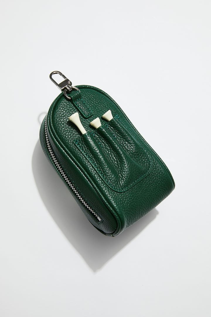 back view of mon purses' dark green pebbled leather golf ball pocket showing 3 golf tees slotted into pockets for golf tees