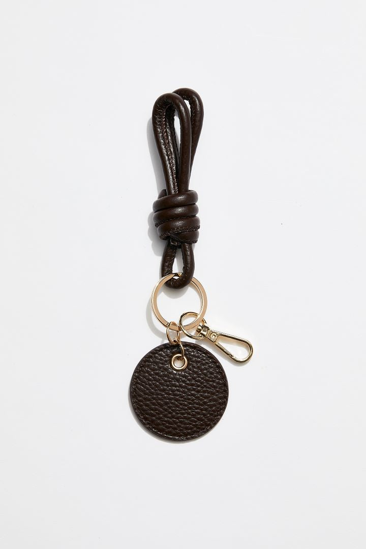 front view of MON Purses' chocolate brown  pebbled leather knotted keyring that features a gold clasp to attach to the inside of your bag.