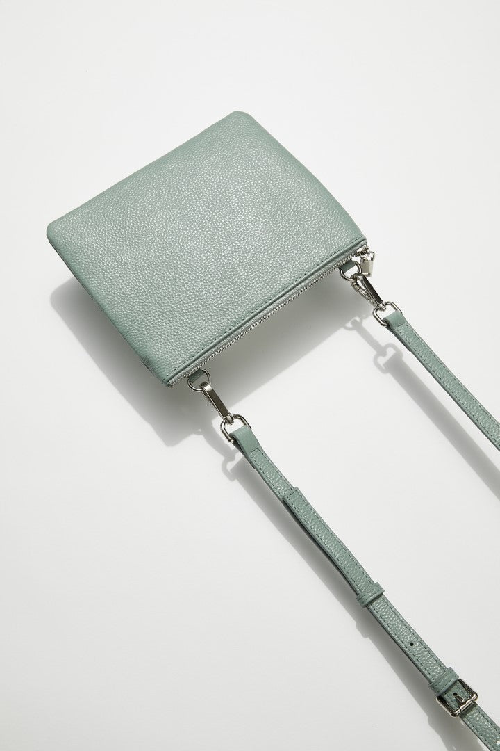 back view of mon purse's sage green pebbled leather single pouch bag