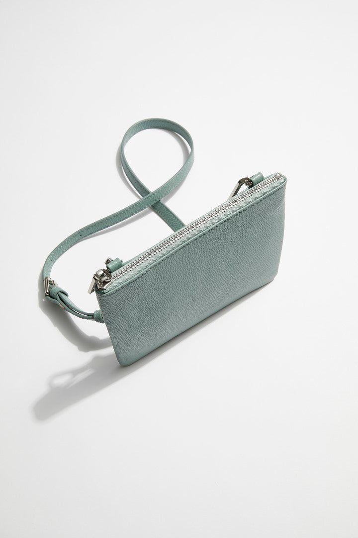 side view of mon purse's sage green pebbled leather single pouch bag
