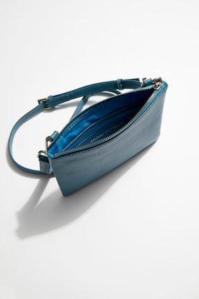 interior view of mon purse's sky blue pebbled leather single pouch bag