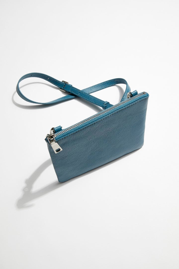 side view of mon purse's sky blue pebbled leather single pouch bag