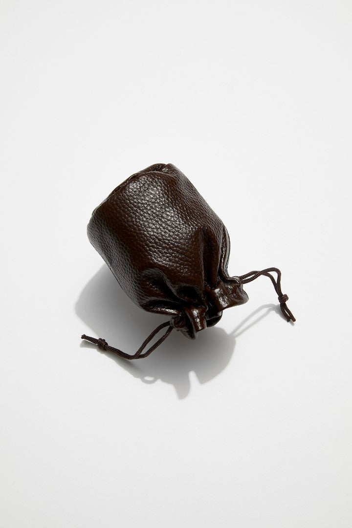 back view of mon purse's chocolate brown pebbled leather trinket pouch with drawstring closure