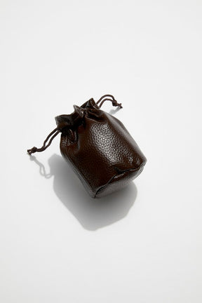front view of mon purse's chocolate brown pebbled leather trinket pouch with drawstring closure