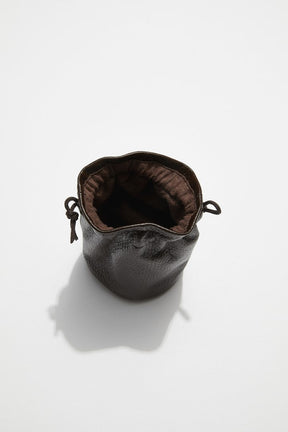 interior view of mon purse's chocolate brown pebbled leather trinket pouch with drawstring closure